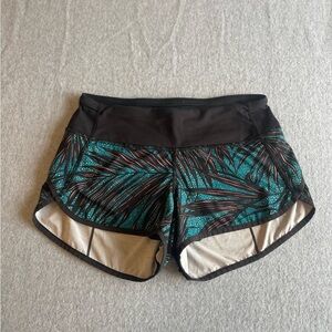 Lululemon Athletica Black and Green Athletic Shorts with Curved Hems